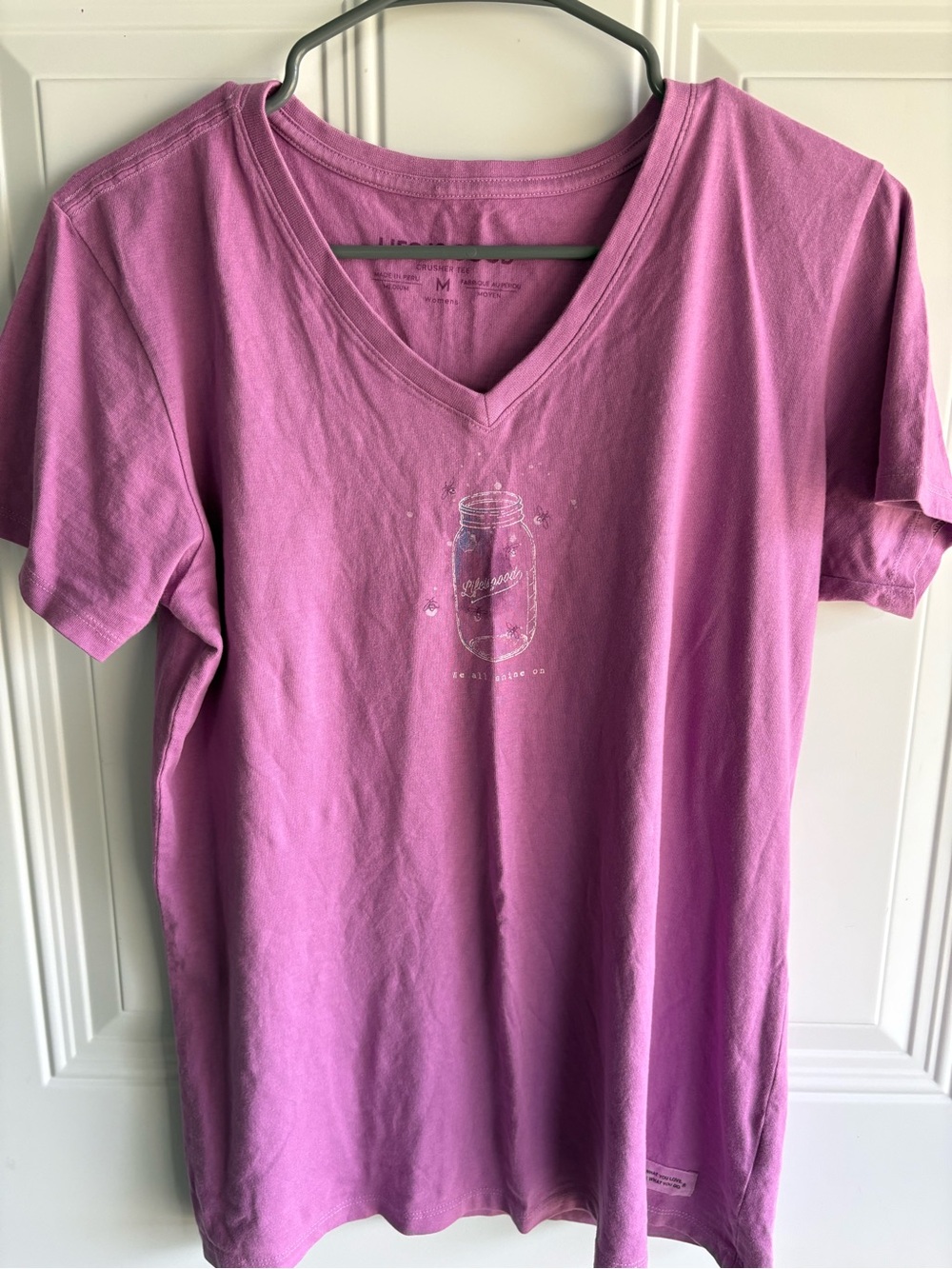 Life Is Good Lavender-Pink V-Neck Short Sleeve Tee “We All Shine On”